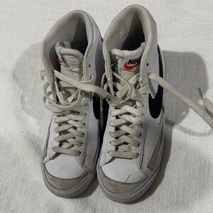 Nike White and Black High-Top Sneakers with Red Logo